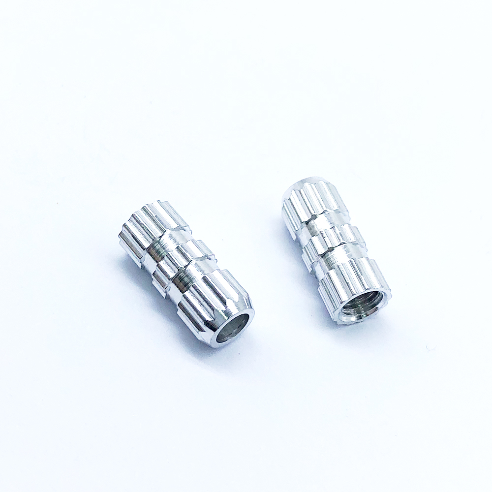 Embedded Nut with Embossed Inlay